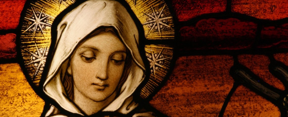 Stained glass depicting the Virgin Mary holding baby Jesus